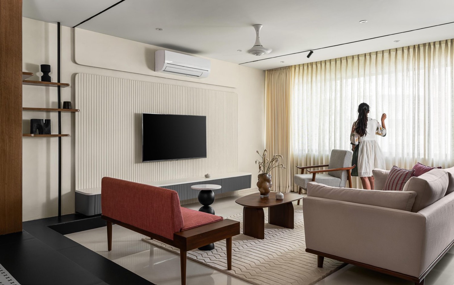 Luxury living room with fluted wall panelling and sheer drapes, Mumbai apartment